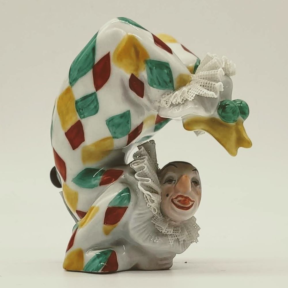 Starožitná porcelánová soška klaun